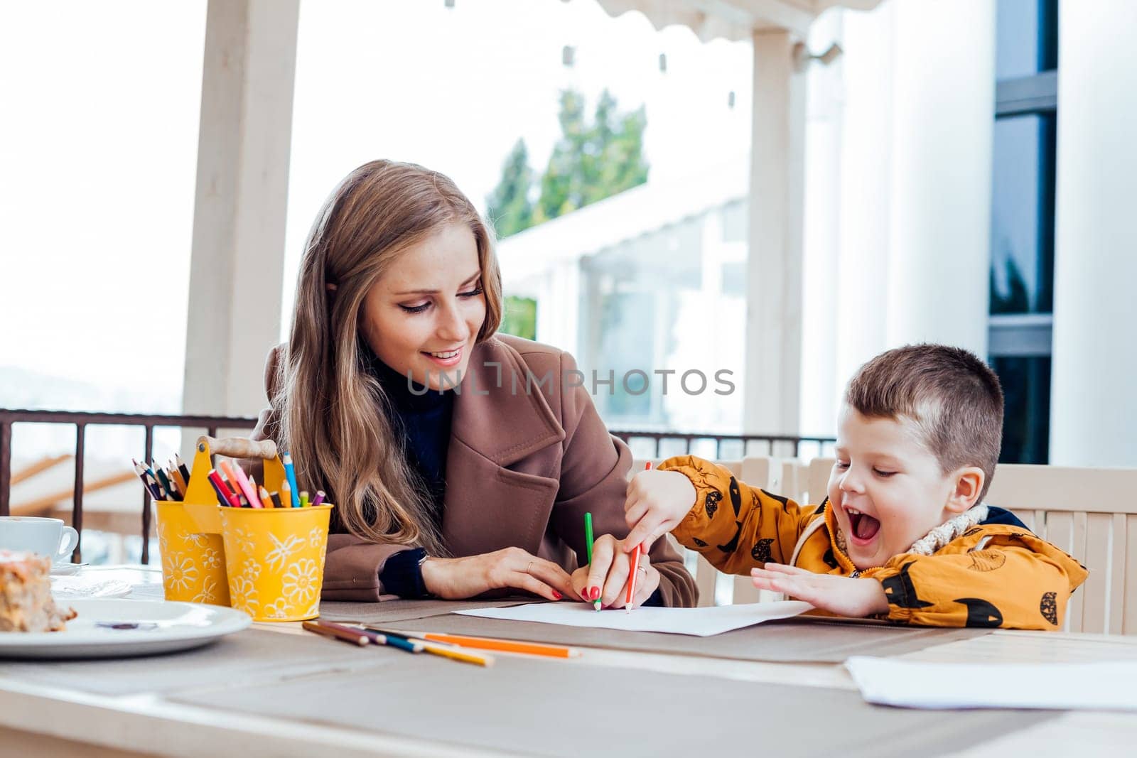 mother and son draw drawing hands colored pencils 1