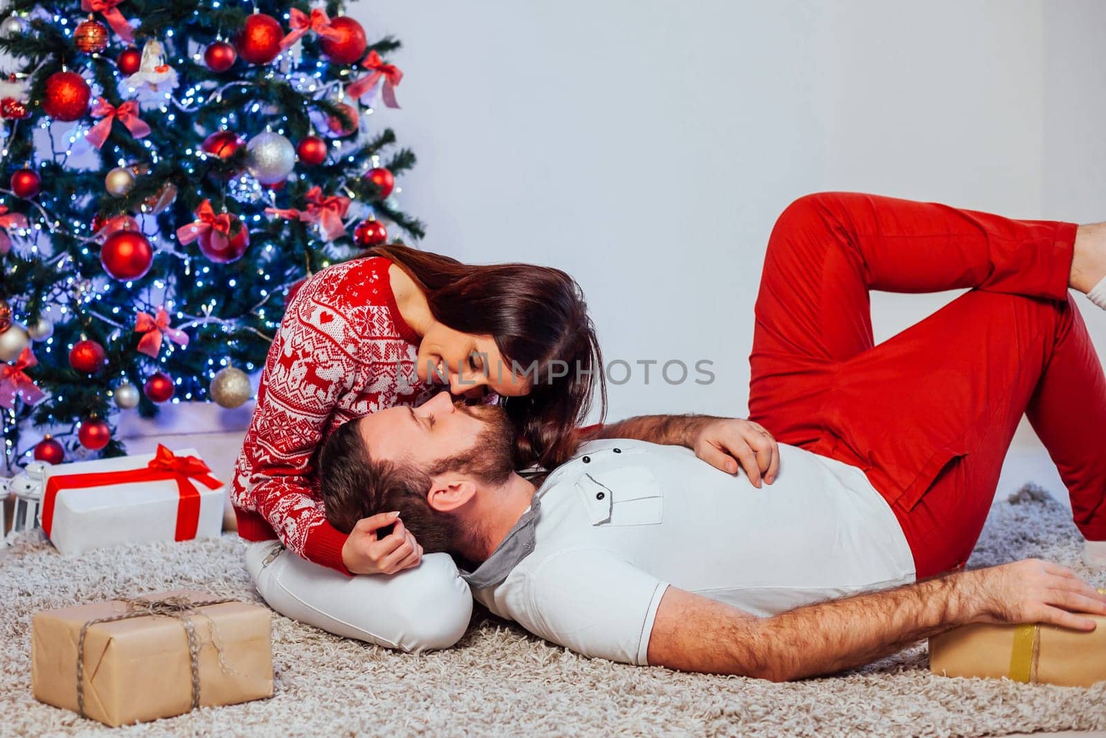 a guy with a girl open Gifts Christmas new year 1