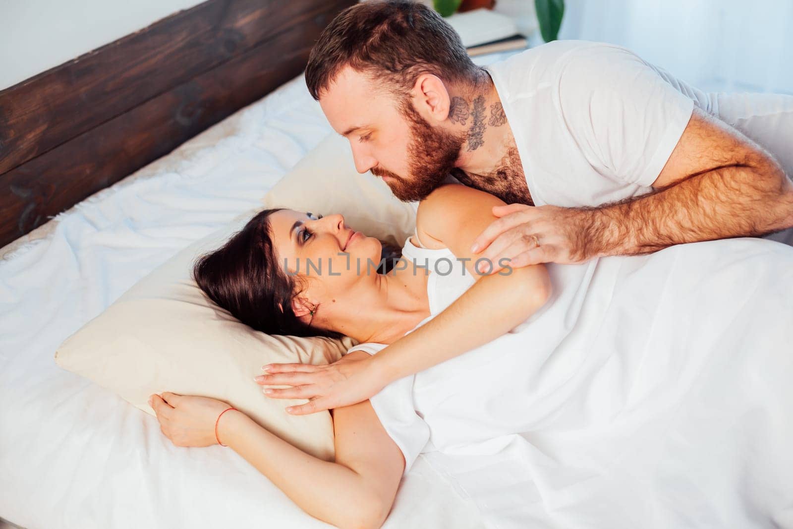 man wakes a woman in the morning 1