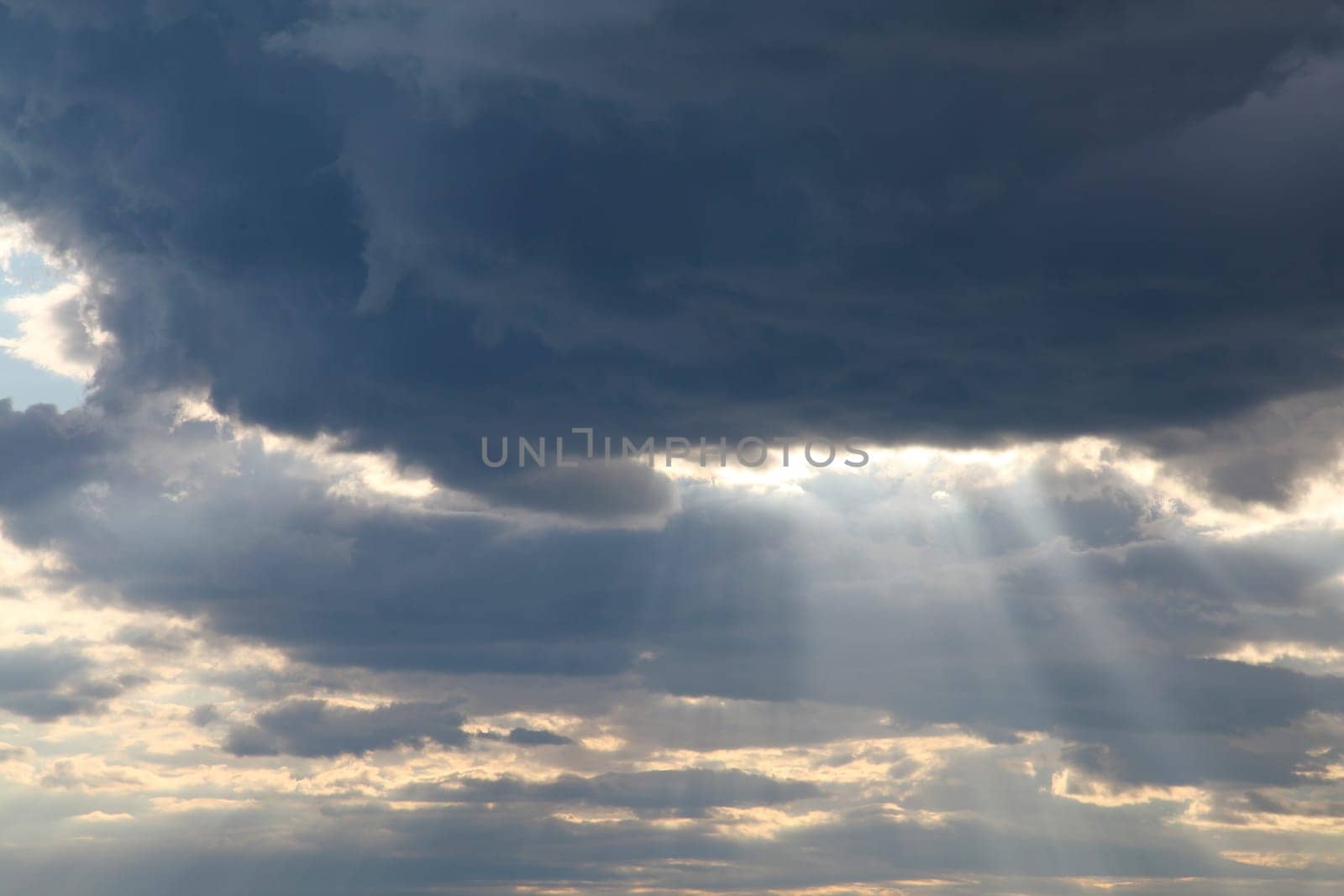 Sky clouds sun rays from the cloud