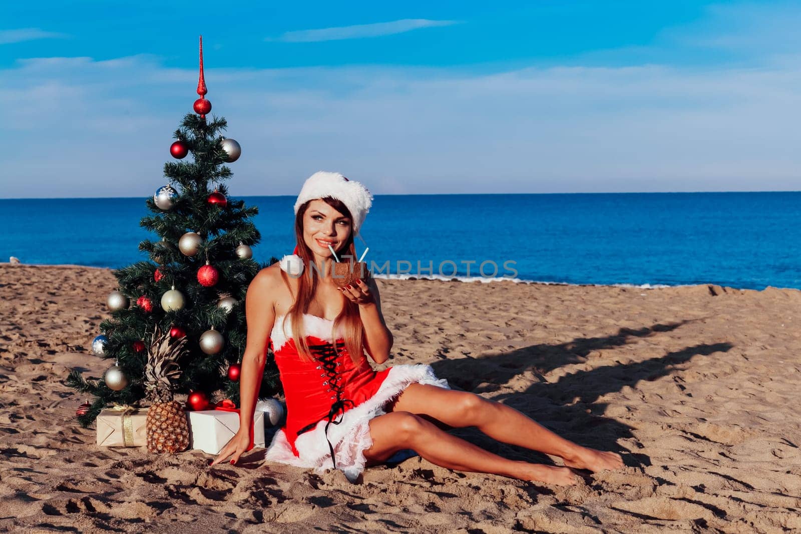 girl Christmas costume Christmas tree in the South on the beach