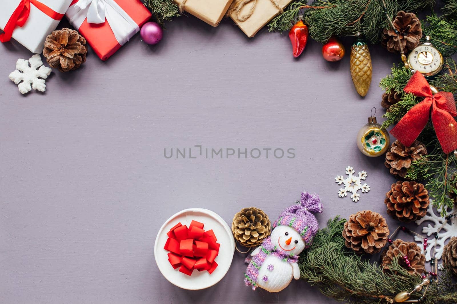 Christmas toys festive gifts decor new year on a purple background by Simakov