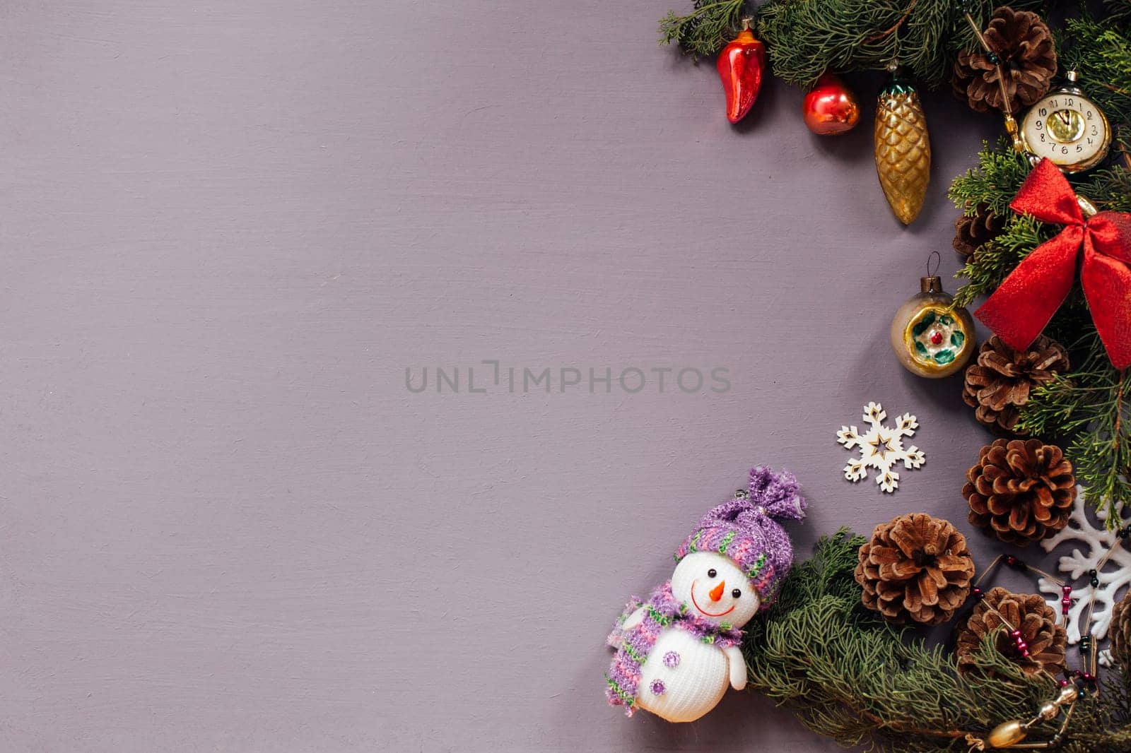 Christmas toys festive gifts decor new year on a purple background by Simakov