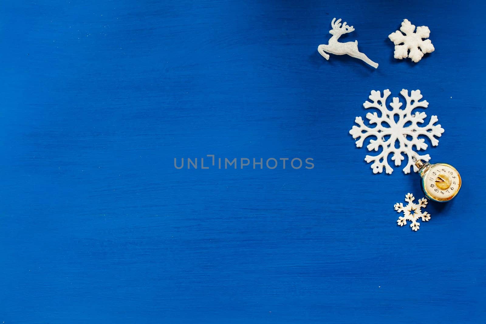 Christmas toys snowflakes presents the new year on a blue background by Simakov
