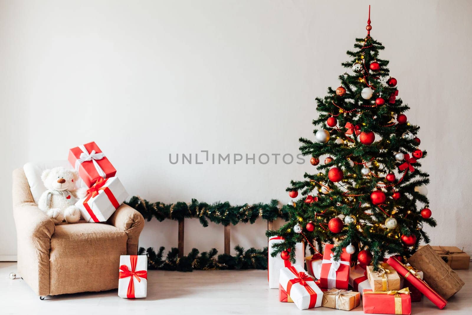 Christmas tree with gifts of red decor for the new year winter