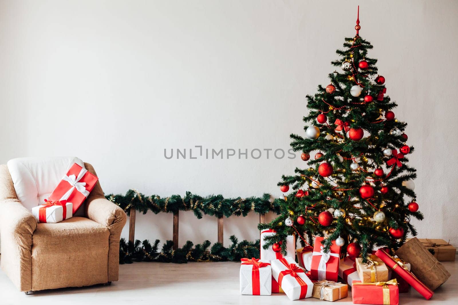 Christmas tree with gifts of red decor for the new year winter