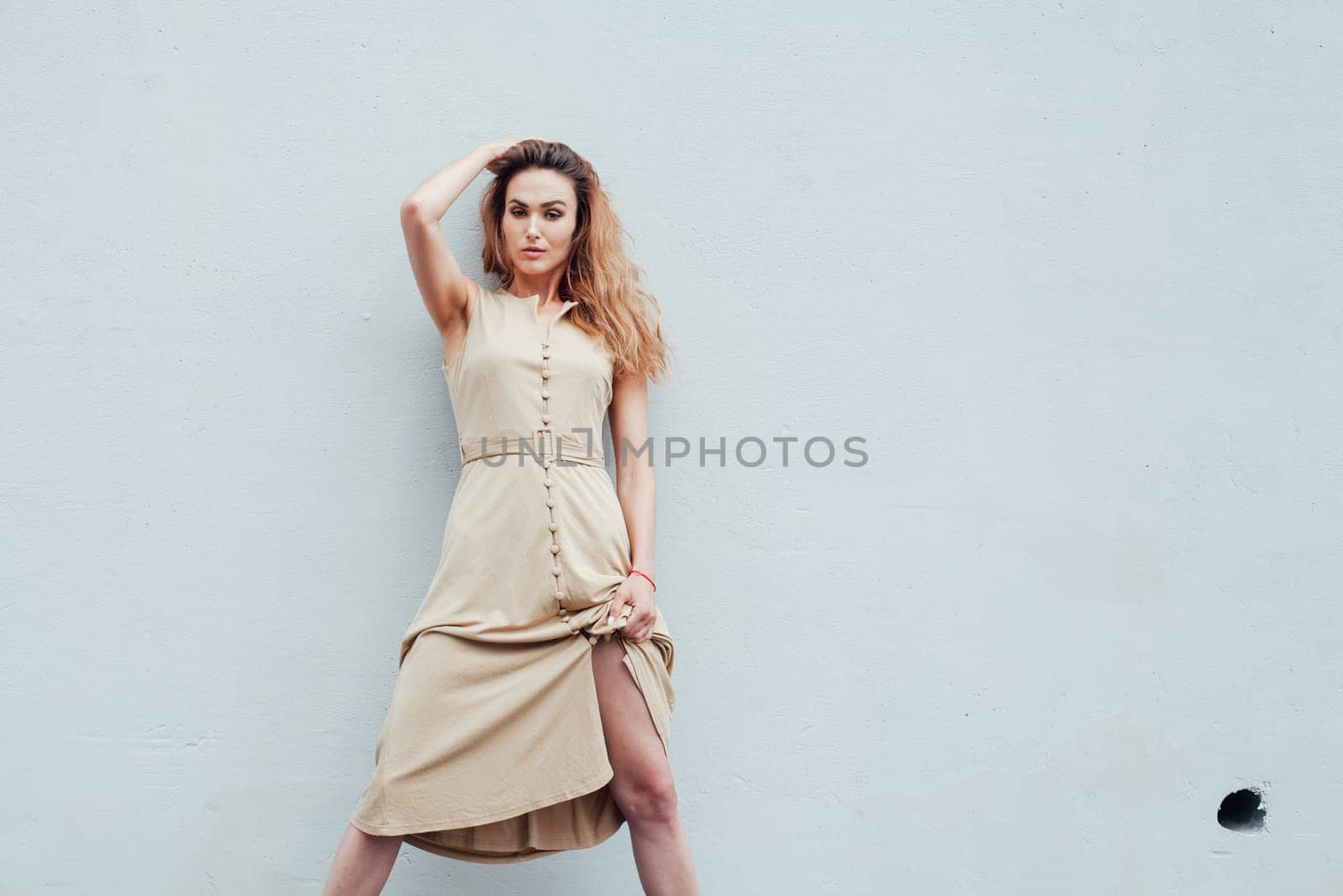 Beautiful fashionable woman in light portrait dress by Simakov