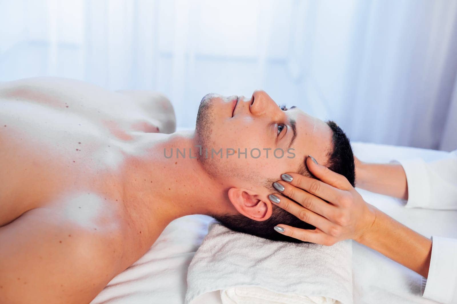 male masseur doing massage health spa procedure 1