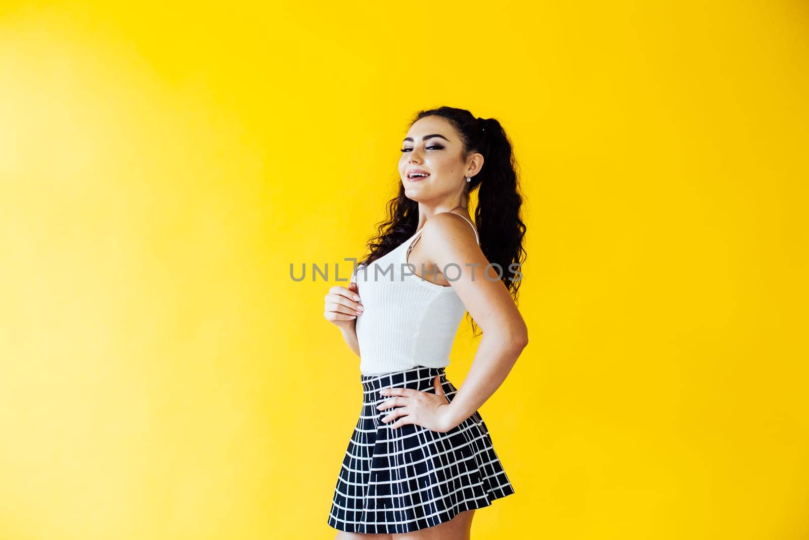 portrait of a beautiful woman on a yellow background