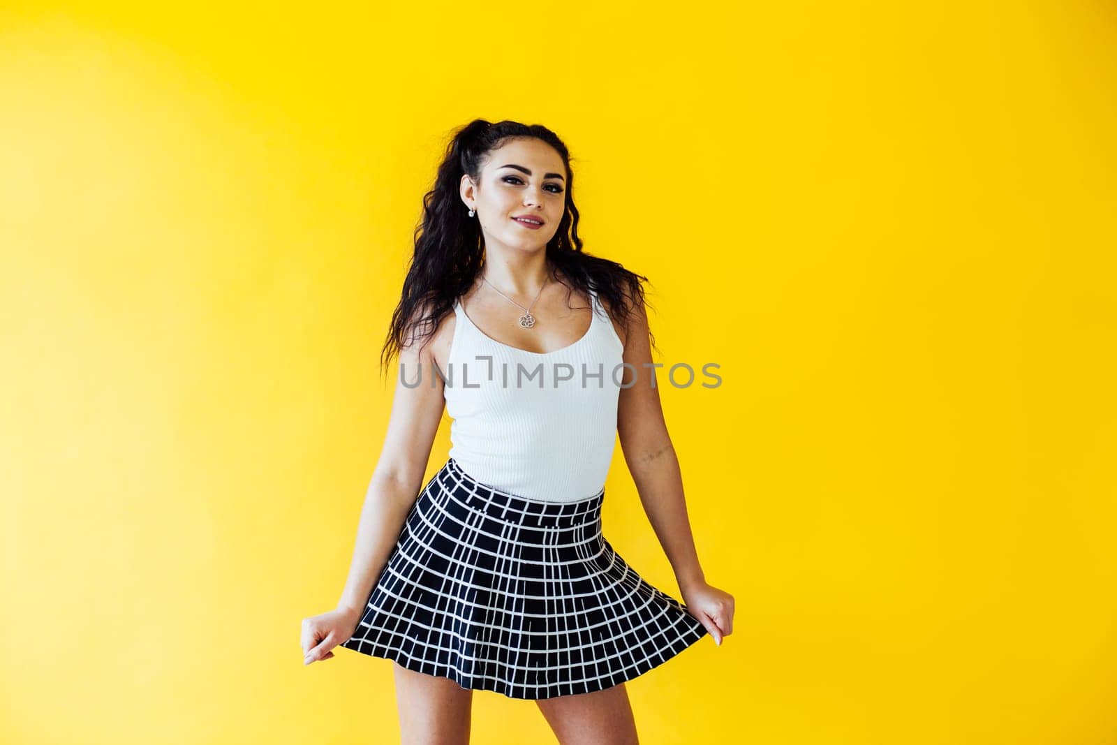 portrait of a beautiful woman on a yellow background