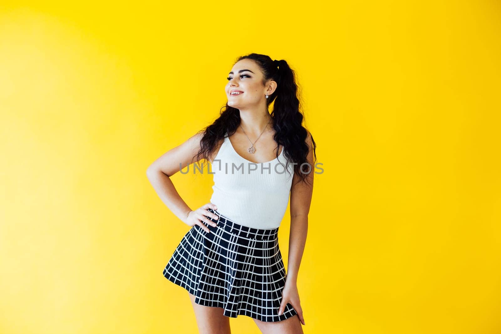 portrait of a beautiful woman on a yellow background