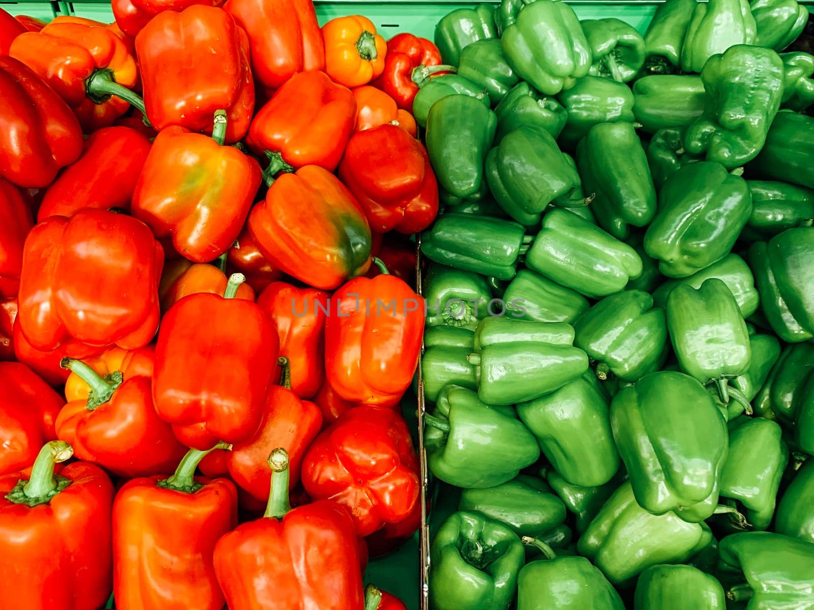 red and green bell pepper ripe vegetables as a background by Simakov