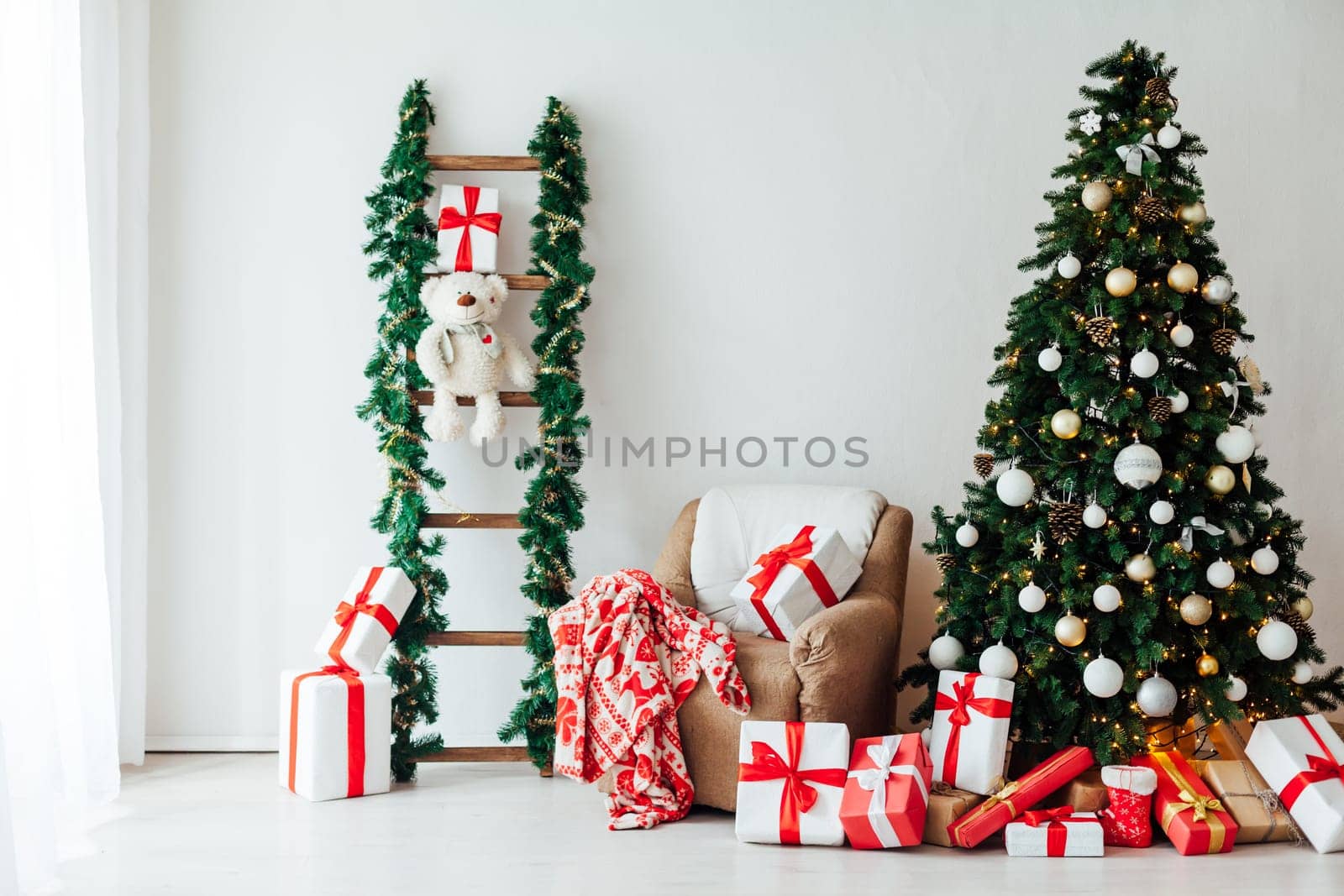decor of the house with christmas tree with New Year's gifts