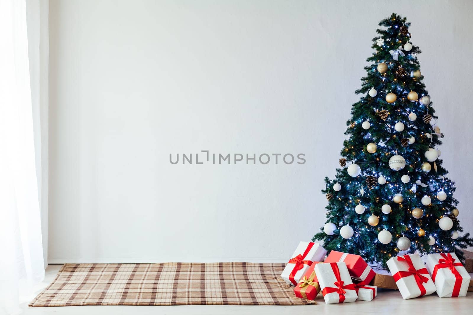 decor of the house with christmas tree with New Year's gifts