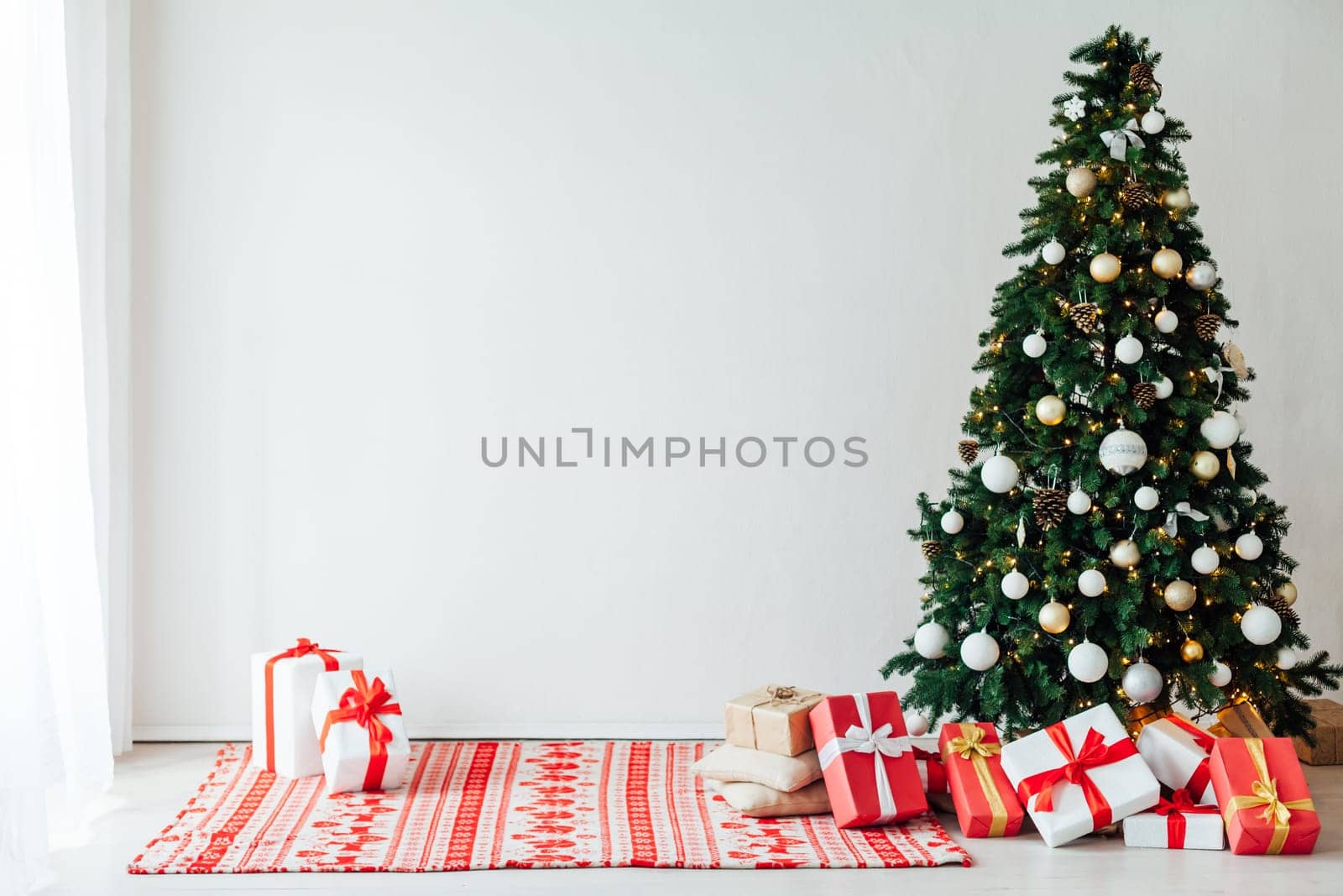 decor of the house with christmas tree with New Year's Thanksgiving gifts by Simakov