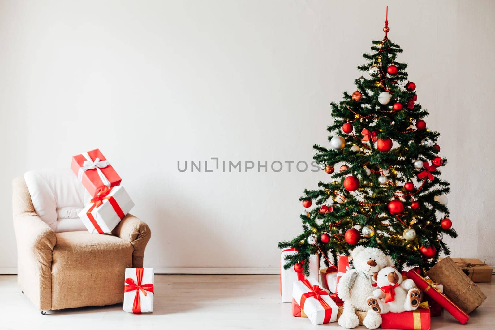 Christmas tree with red gifts decor white interior for the new year by Simakov