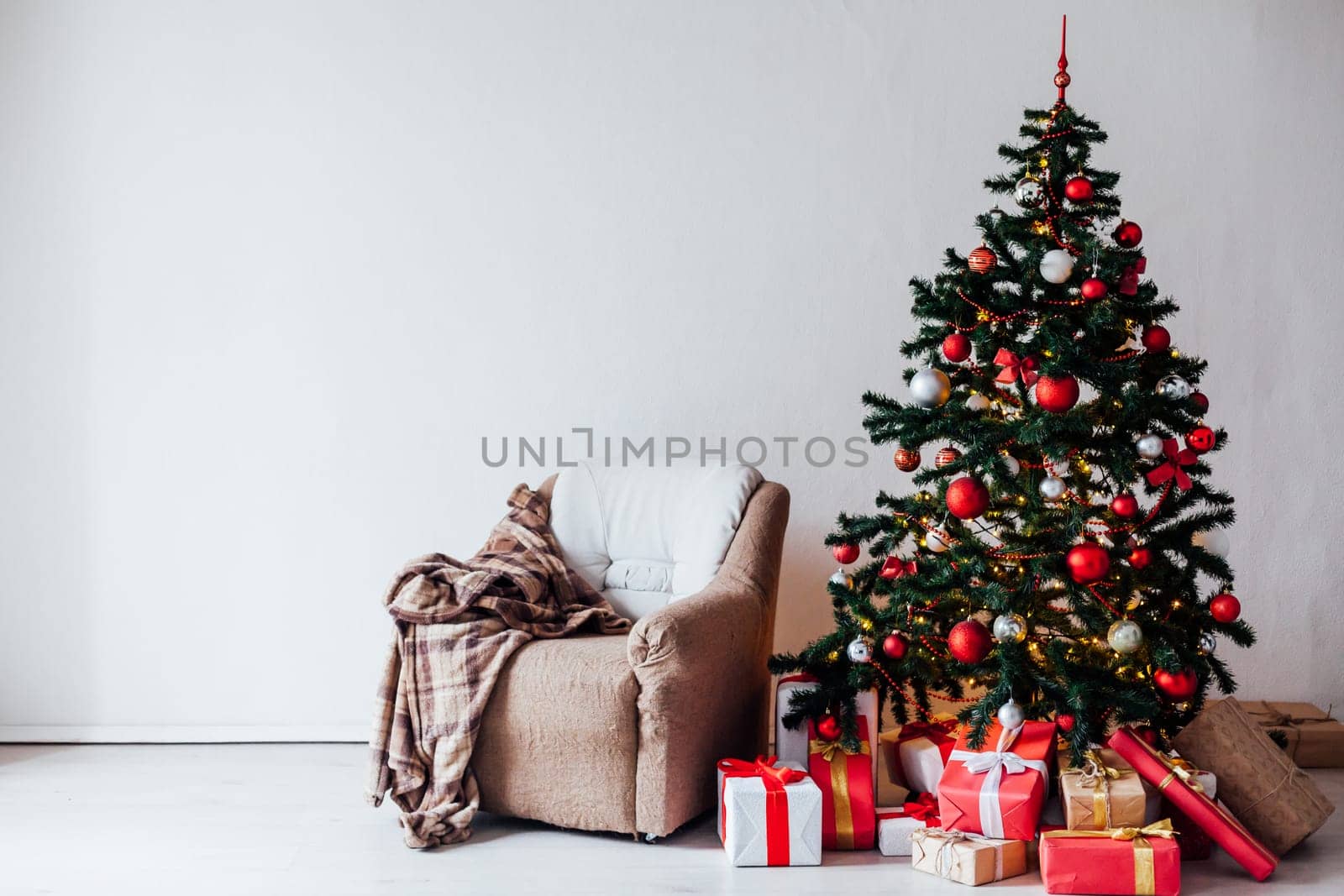 Christmas tree with red gifts decor interior for the new year by Simakov