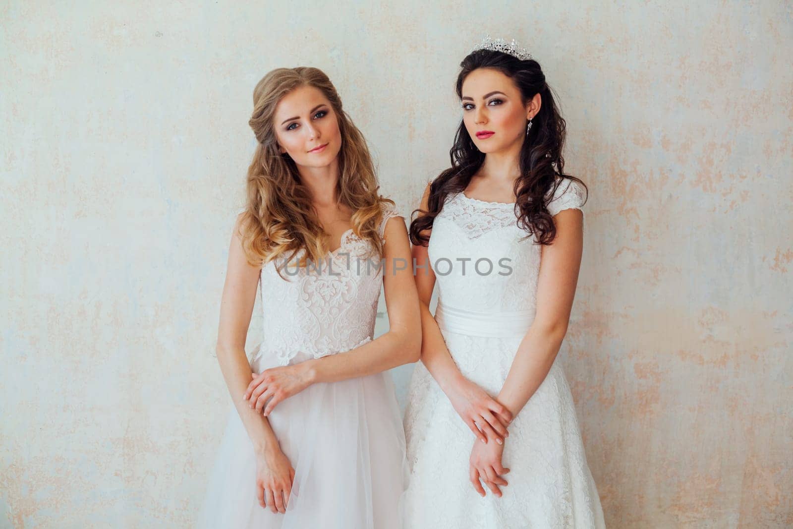 two brides in wedding dresses wedding blonde brunette girlfriend