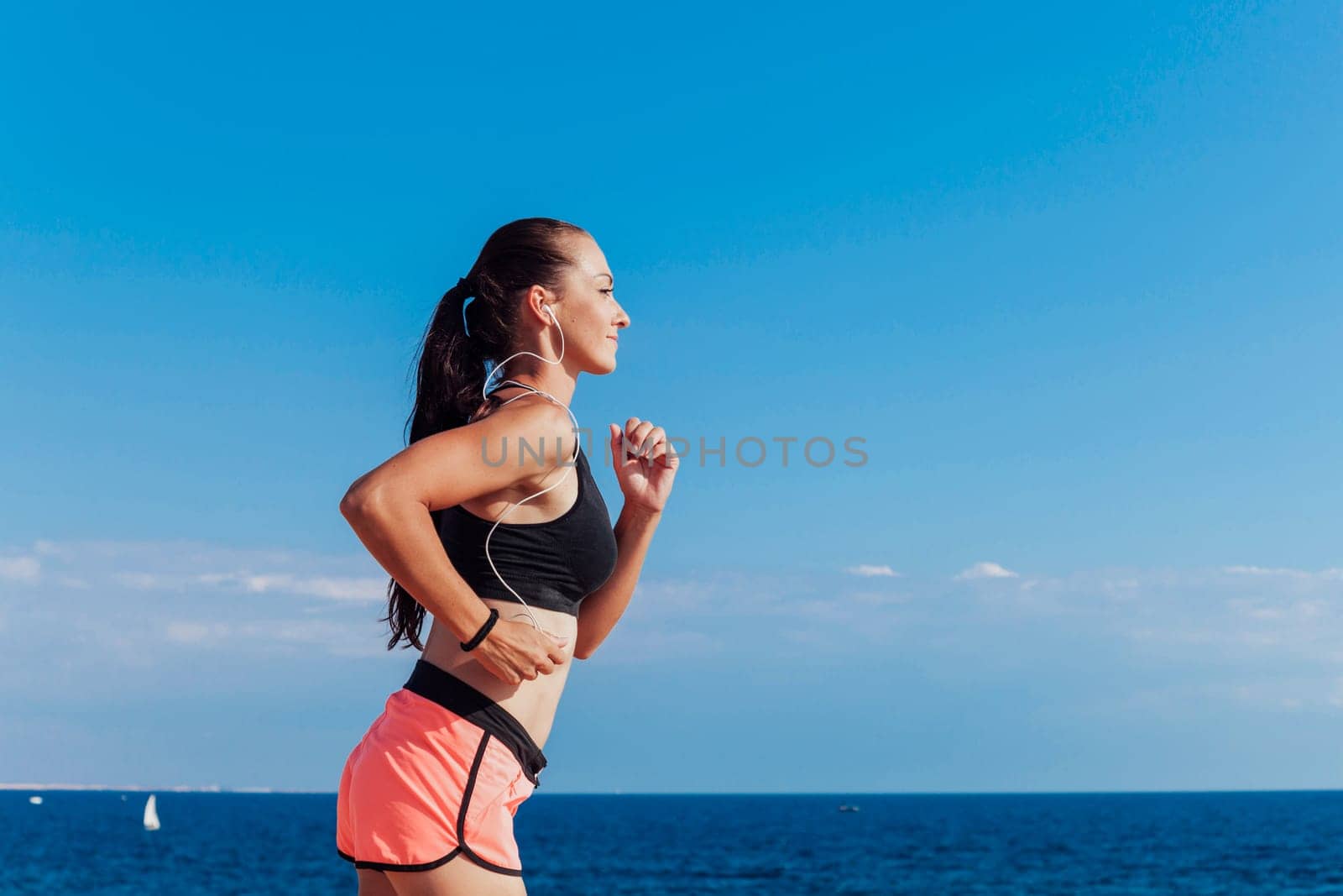 girl plays sports morning jog on the beach