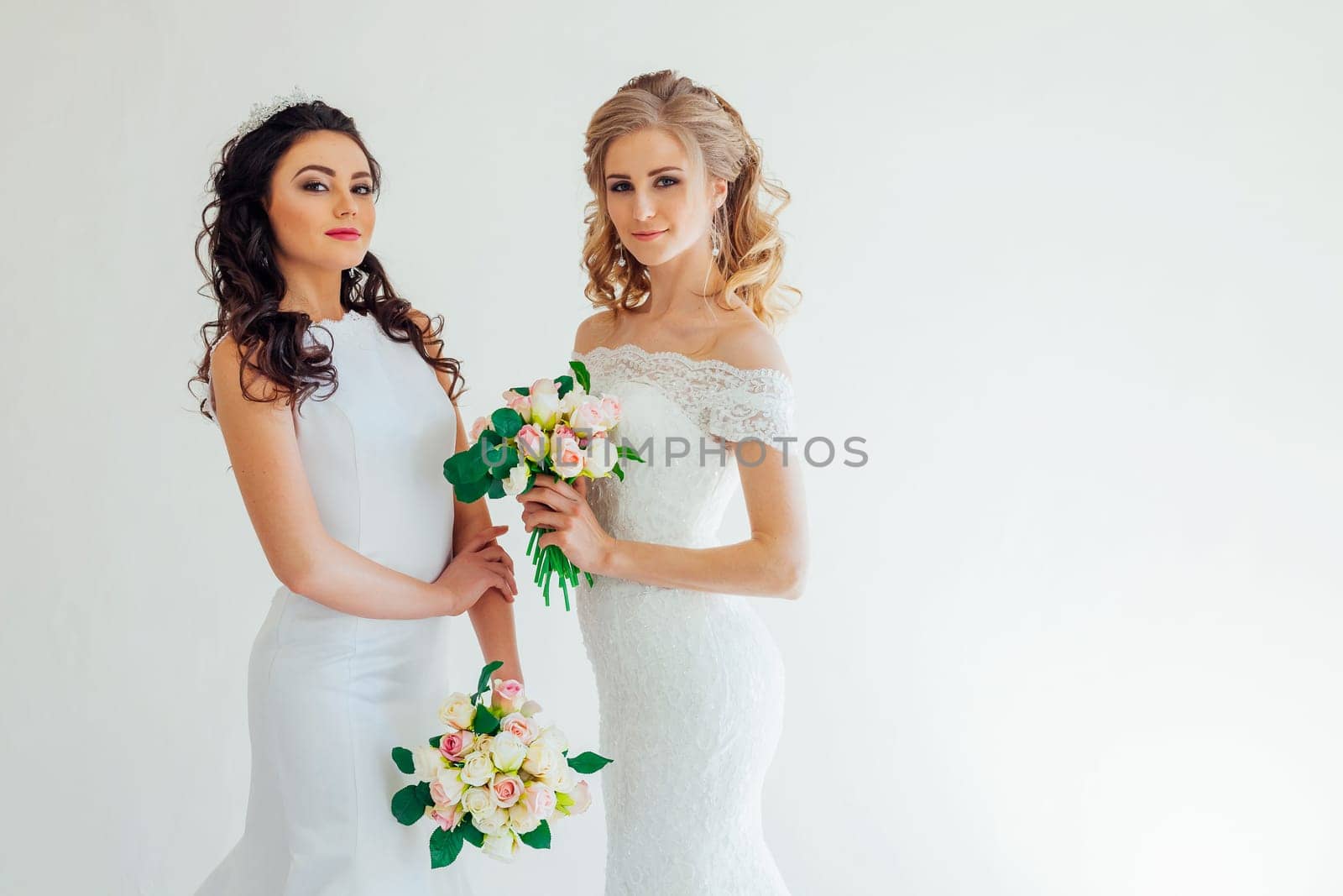 two wedding bride with bouquet wedding hairstyle