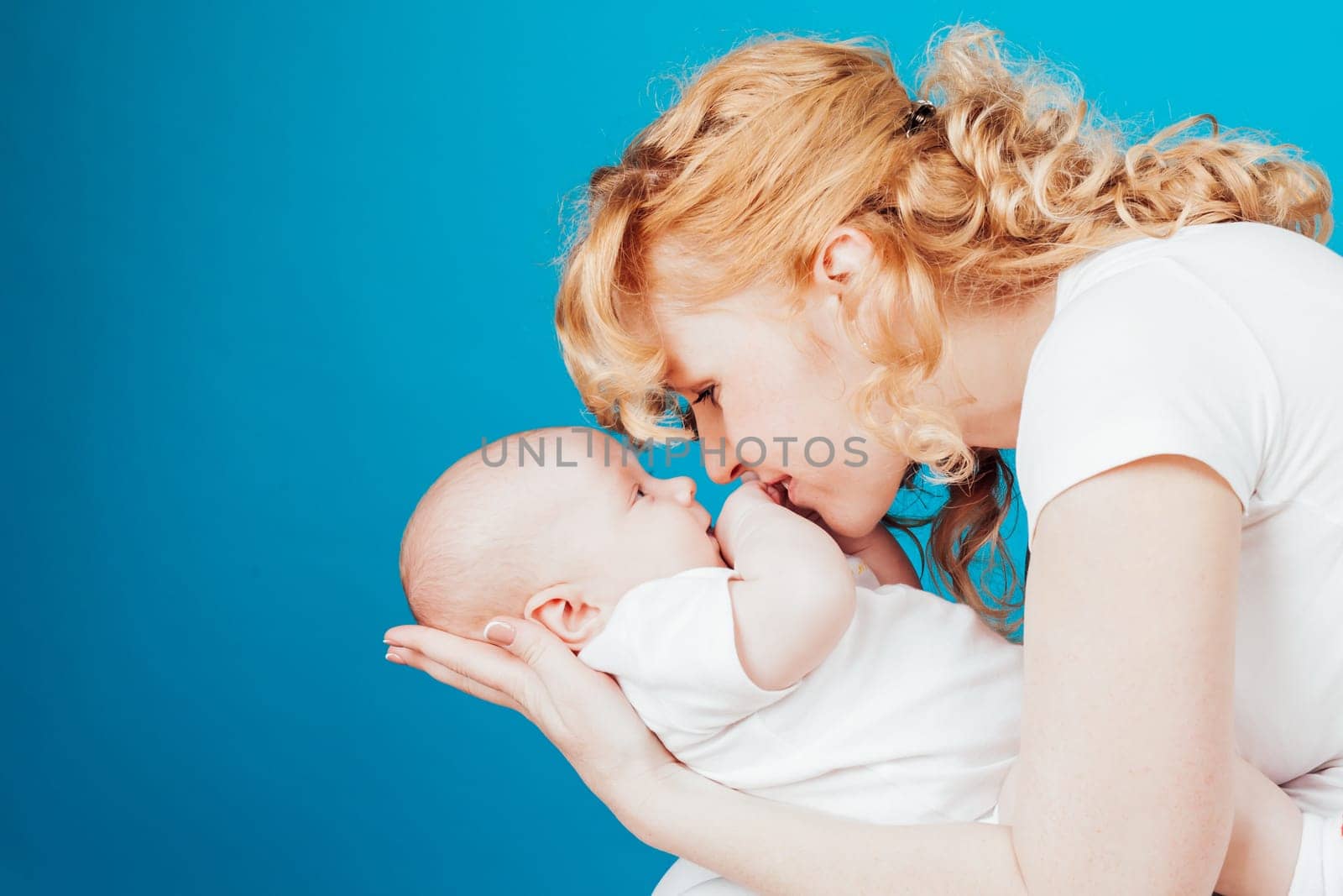 mom keeps on hand a baby son love happiness family