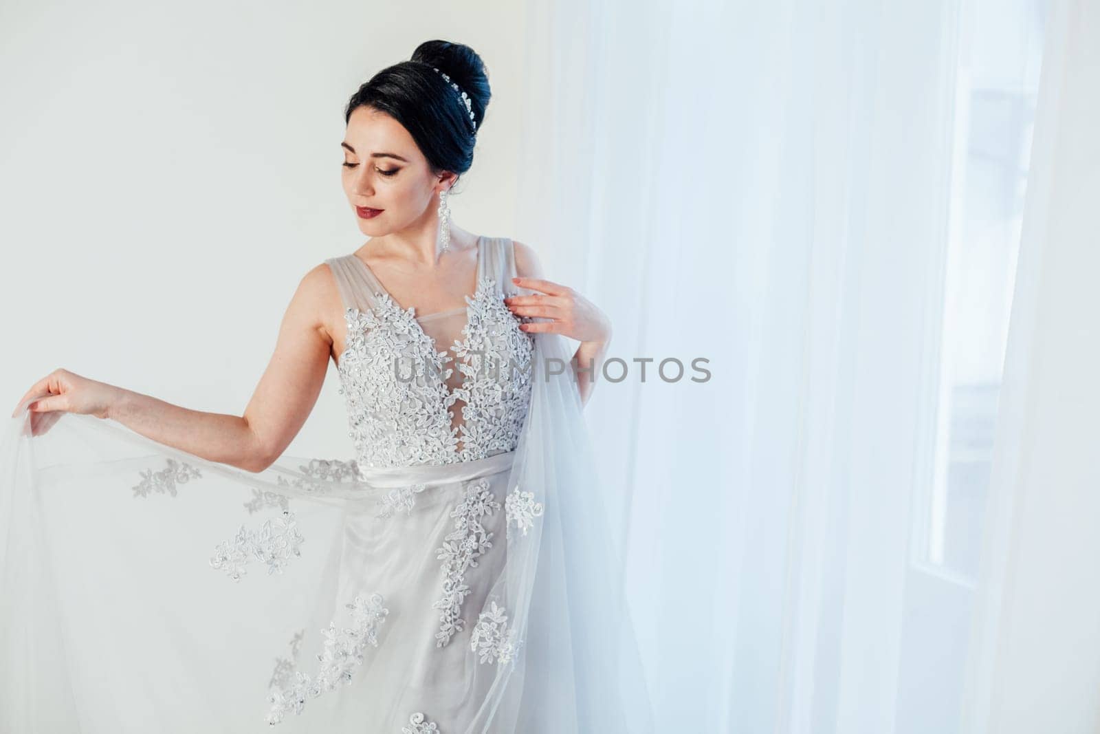 brunette woman in gray wedding gown white by Simakov