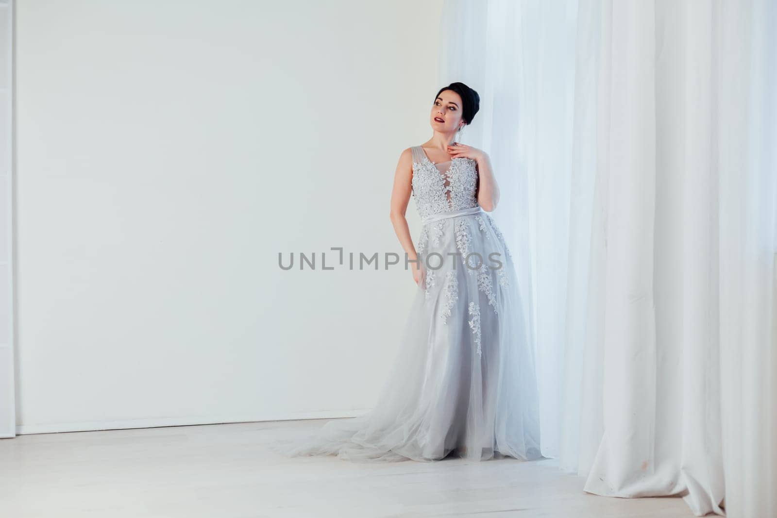 brunette woman in gray wedding gown white by Simakov