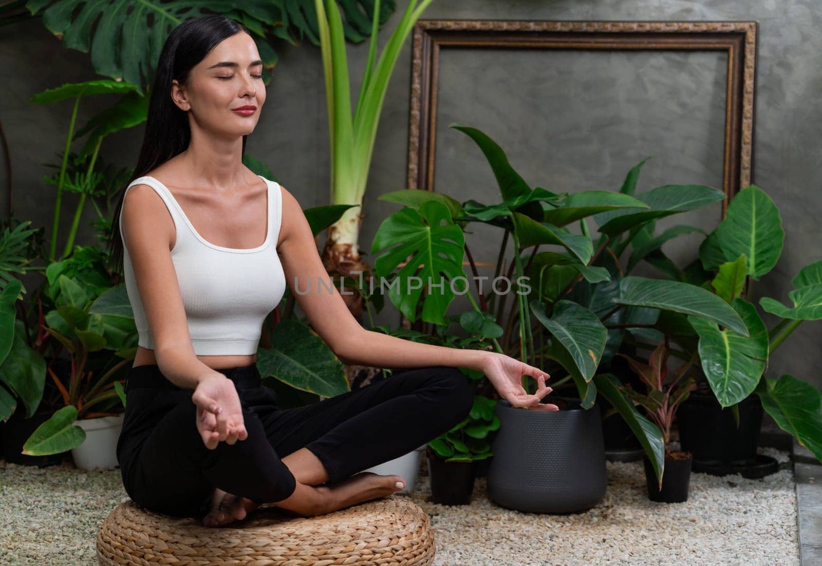 Young woman doing morning yoga and meditation in her bedroom. Blithe by biancoblue