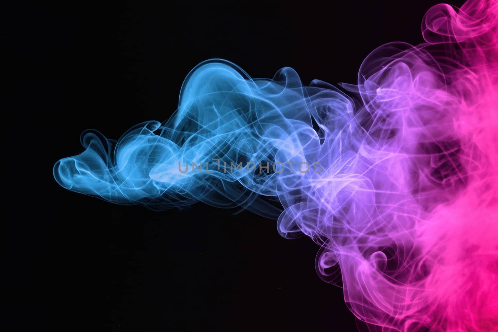 Abstract colorful smoke on black background. by yilmazsavaskandag