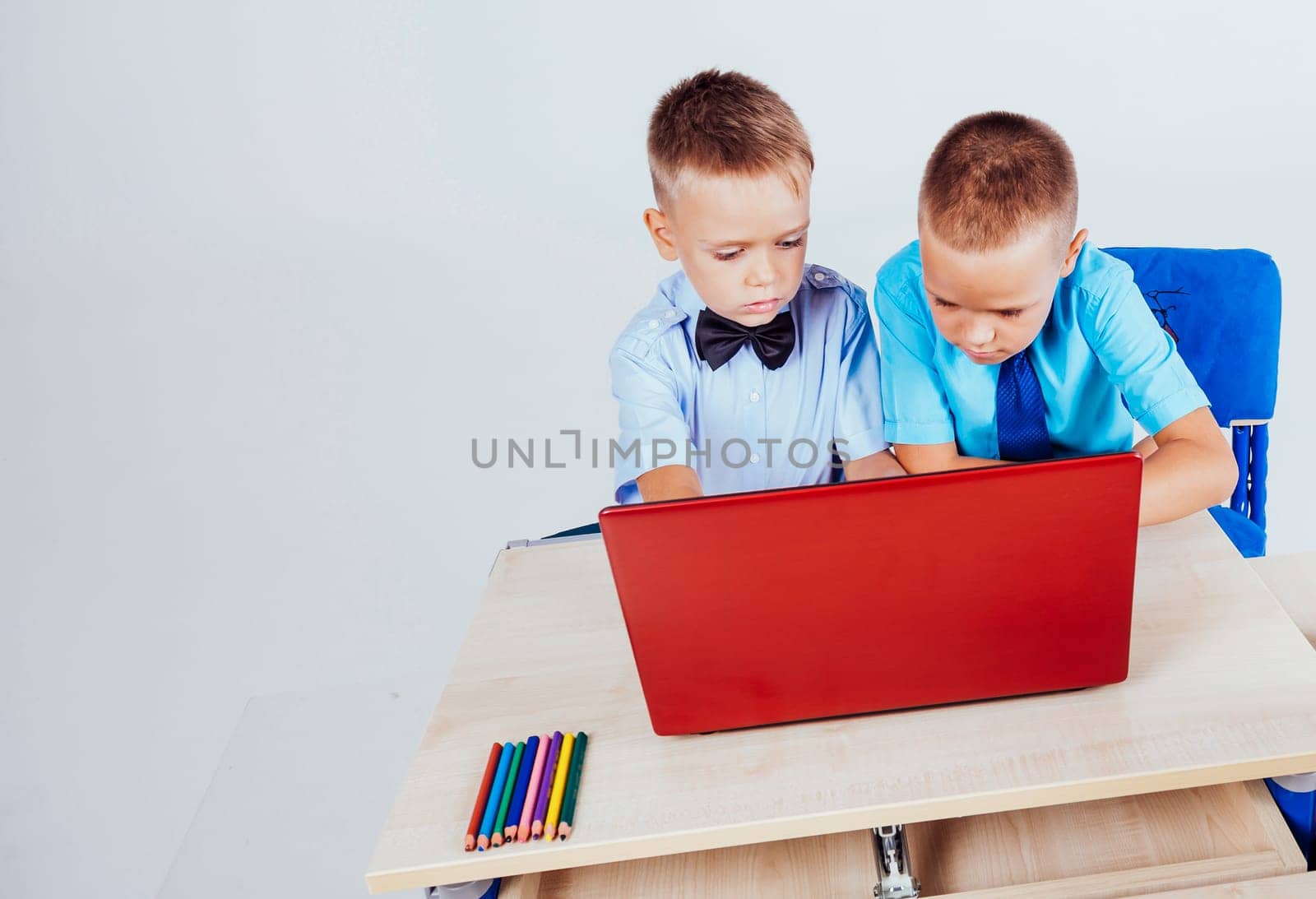 boys at a computer on the Internet school lessons 1