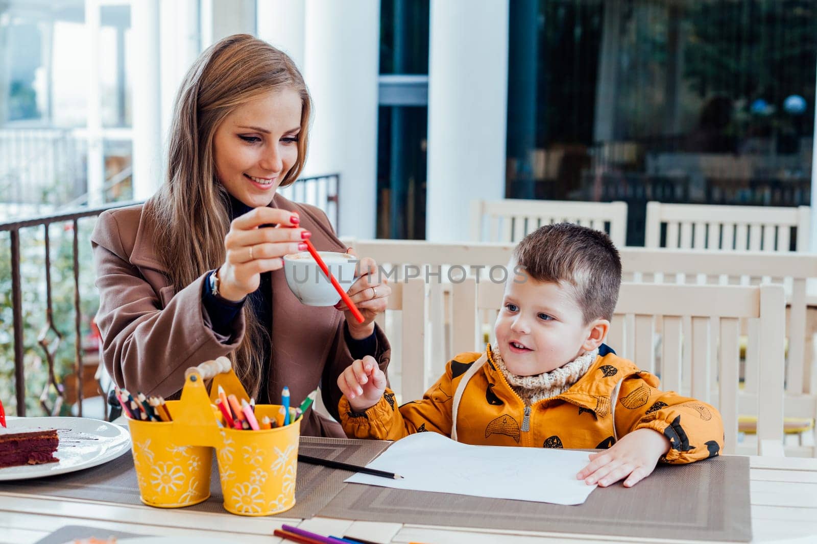 mother and son draw drawing hands colored pencils by Simakov