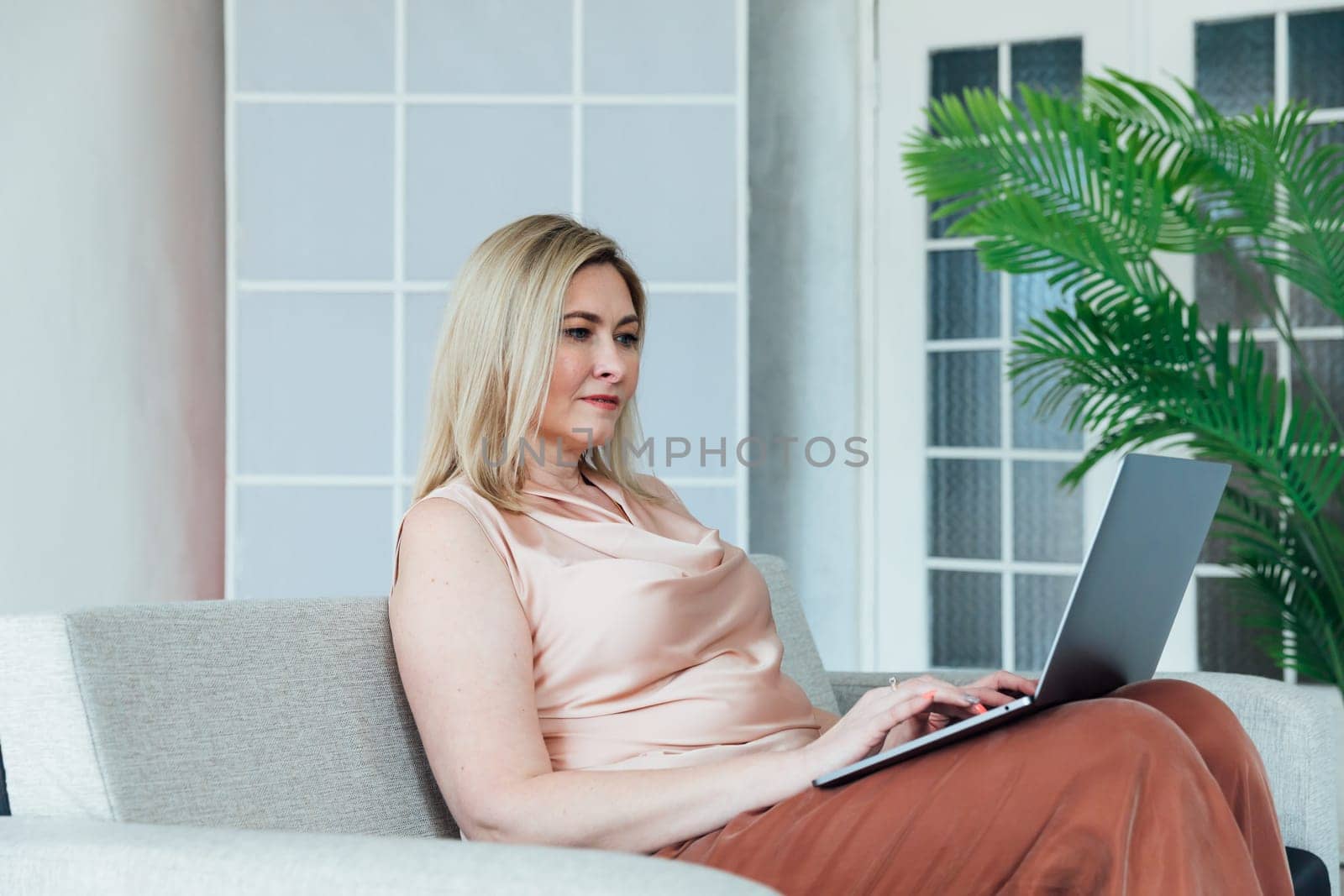 Woman working remotely on laptop online finance