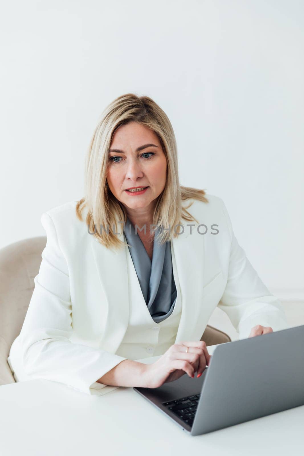 woman working on laptop online from office