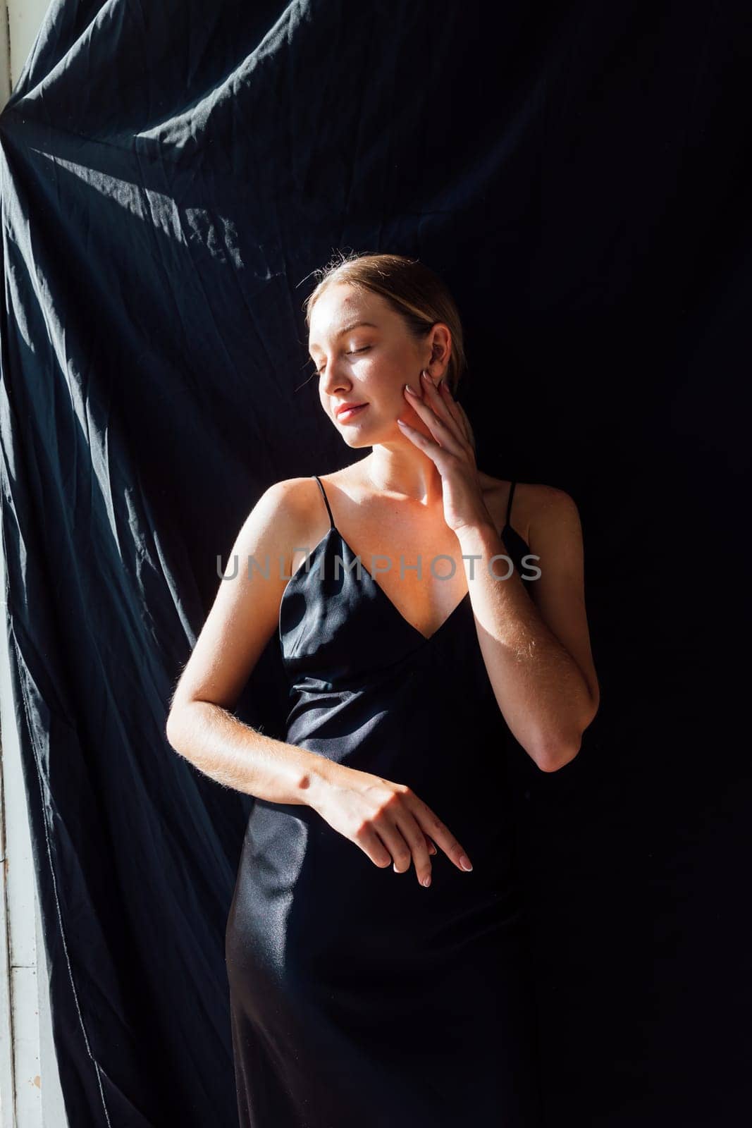 beautiful fashionable woman in black silk dress by Simakov