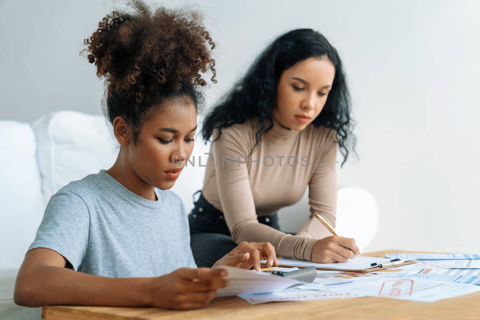 Stressed African American women has financial problems with credit card debt to pay crucial show concept of bad personal money and mortgage pay management crisis.