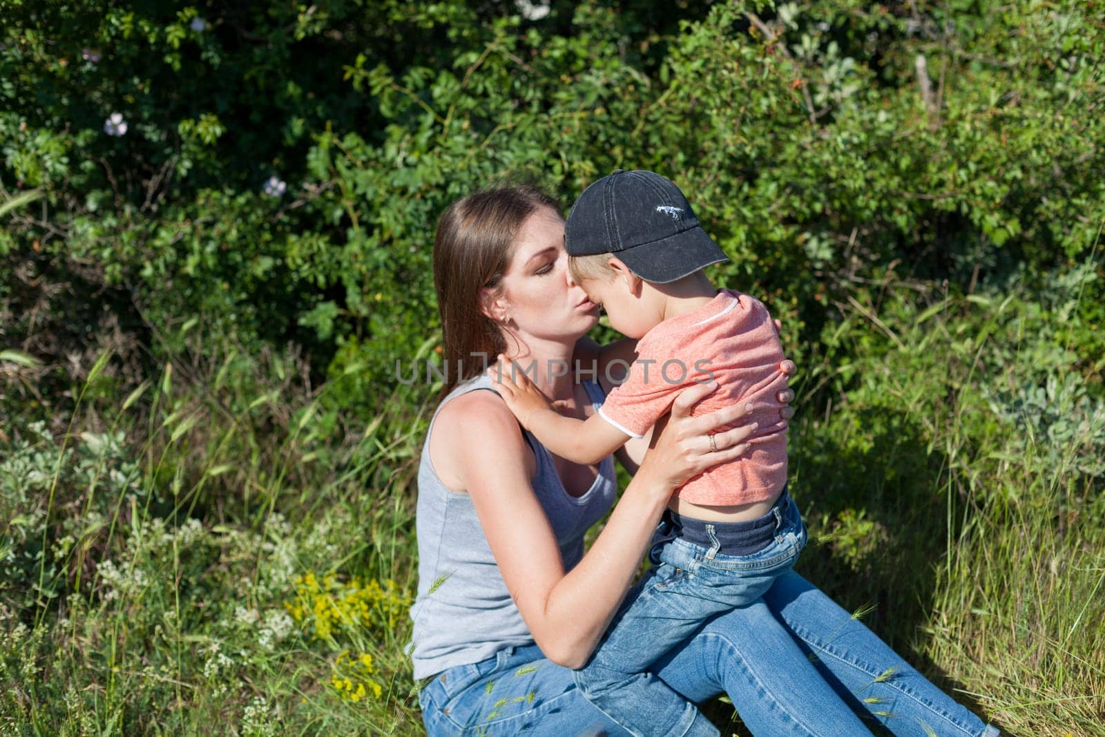 mom with her son on a picnic rest in nature