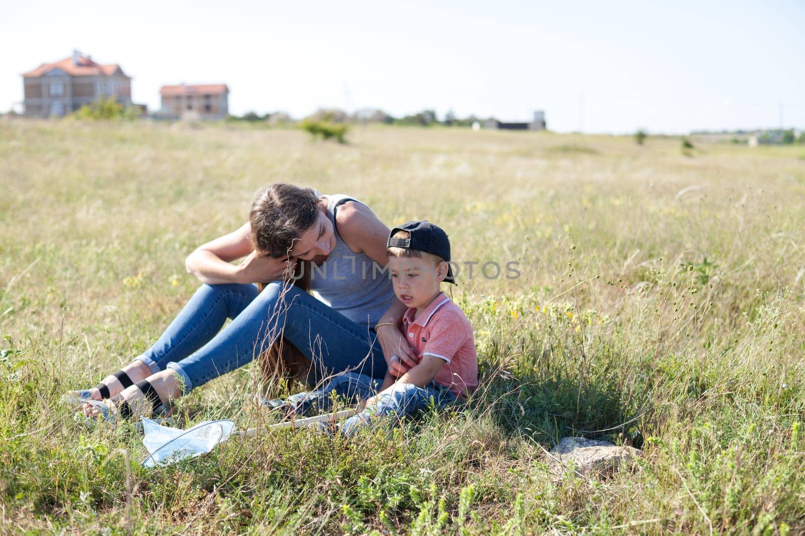 mom with her son on a picnic rest in nature