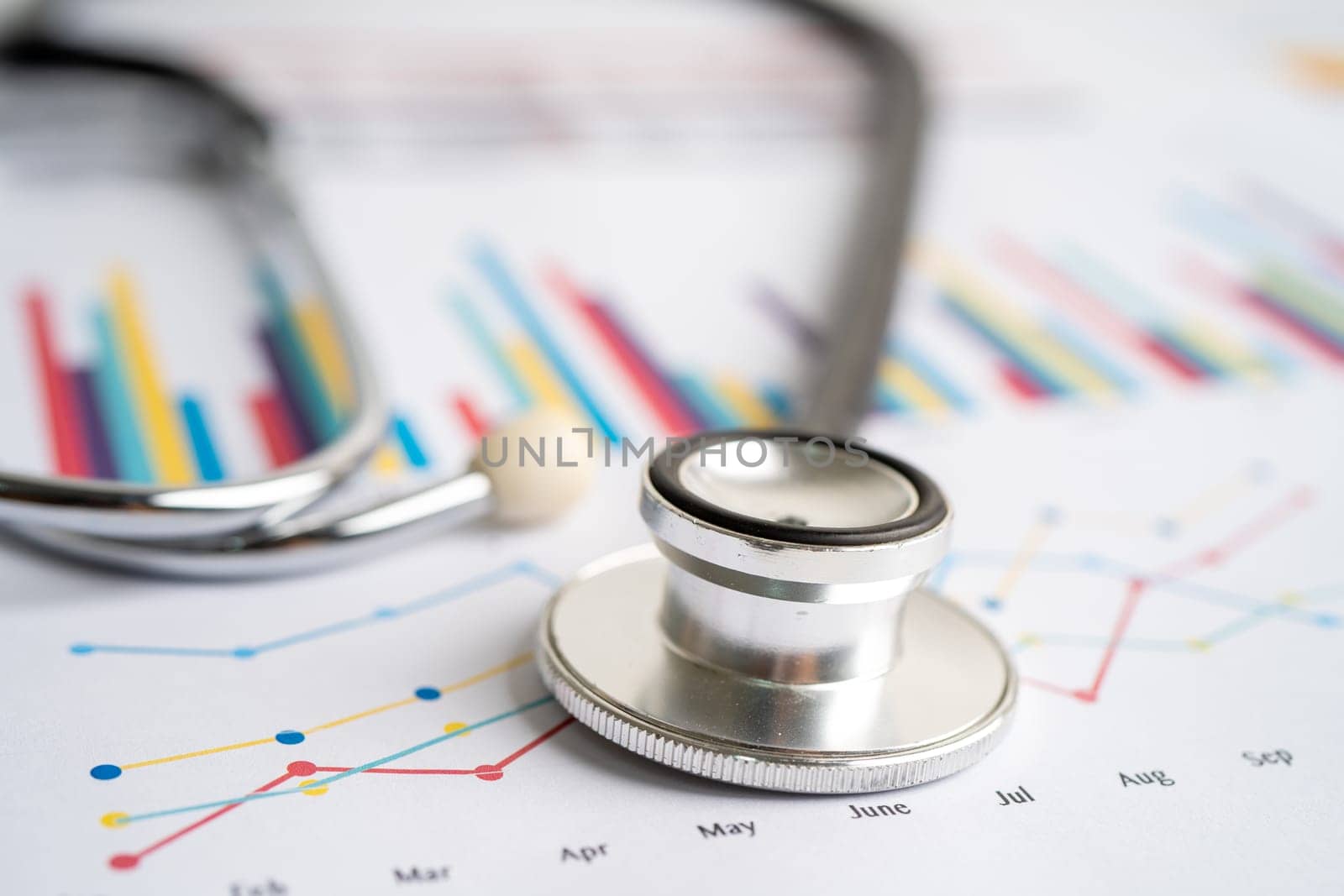 Stethoscope on graph paper, Finance, Account, Statistics, Investment, Analytic research data economy and Business company concept. by pamai