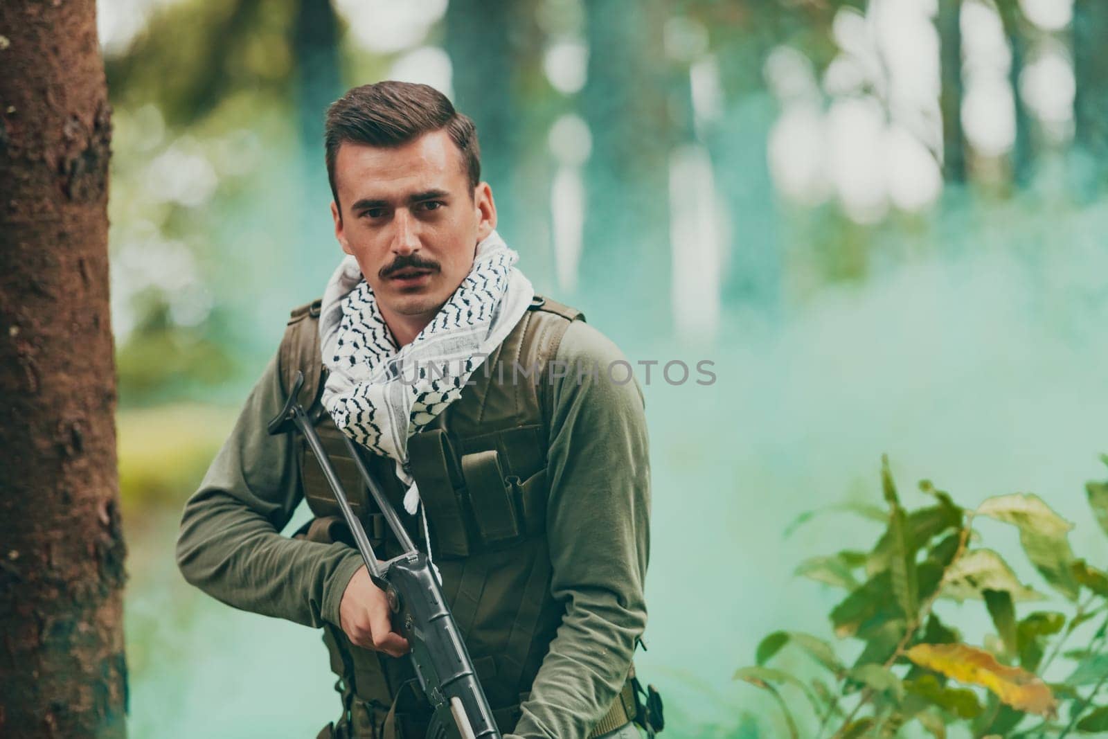 Angry terrorist militant guerrilla soldier warrior in forest by dotshock