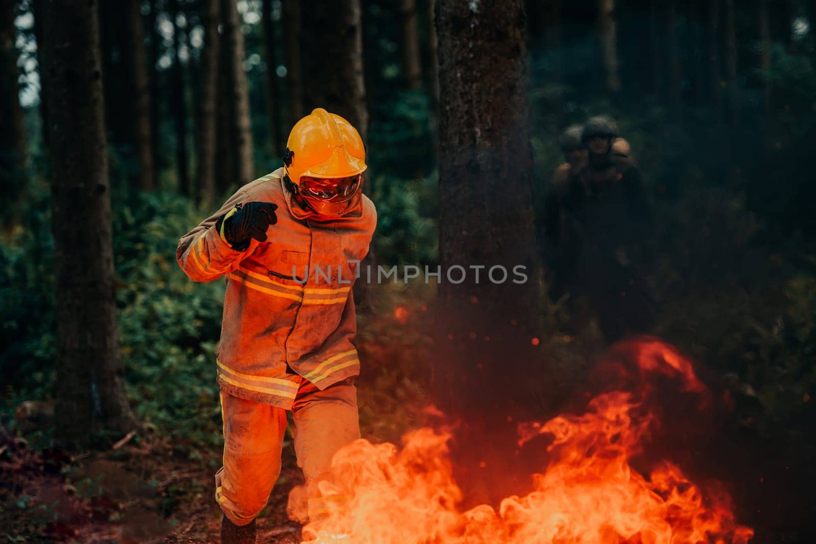 firefighter hero in action danger jumping over fire flame to rescue and save by dotshock