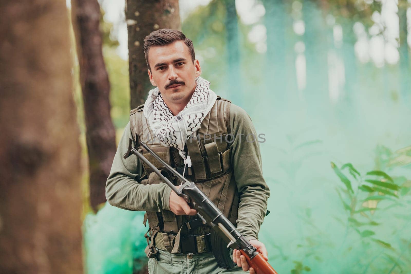 Angry terrorist militant guerrilla soldier warrior in forest.
