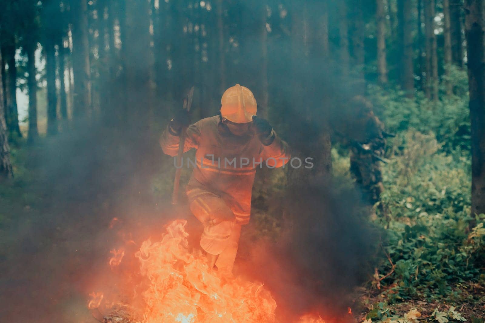 firefighter hero in action danger jumping over fire flame to rescue and save.