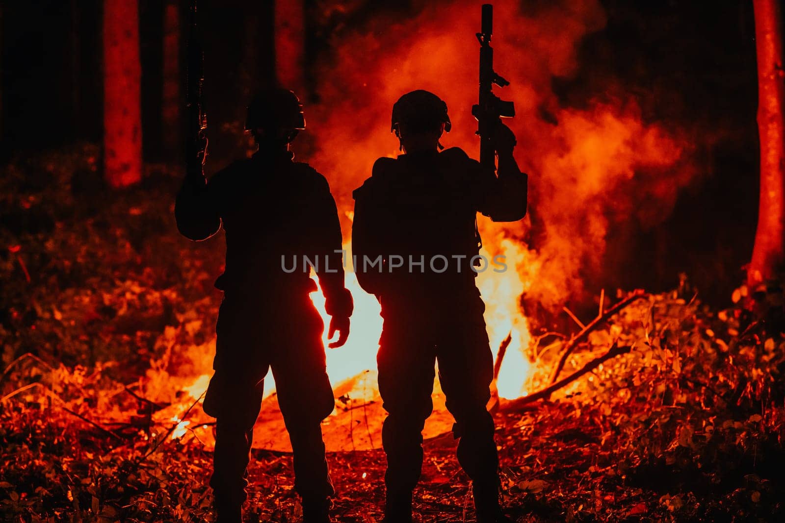 Special marines military forces squad soldiers group portrait after finished mission complete fire in background.