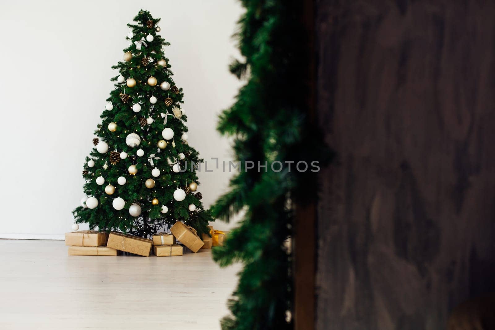 Christmas tree with gifts in the new year decor interior