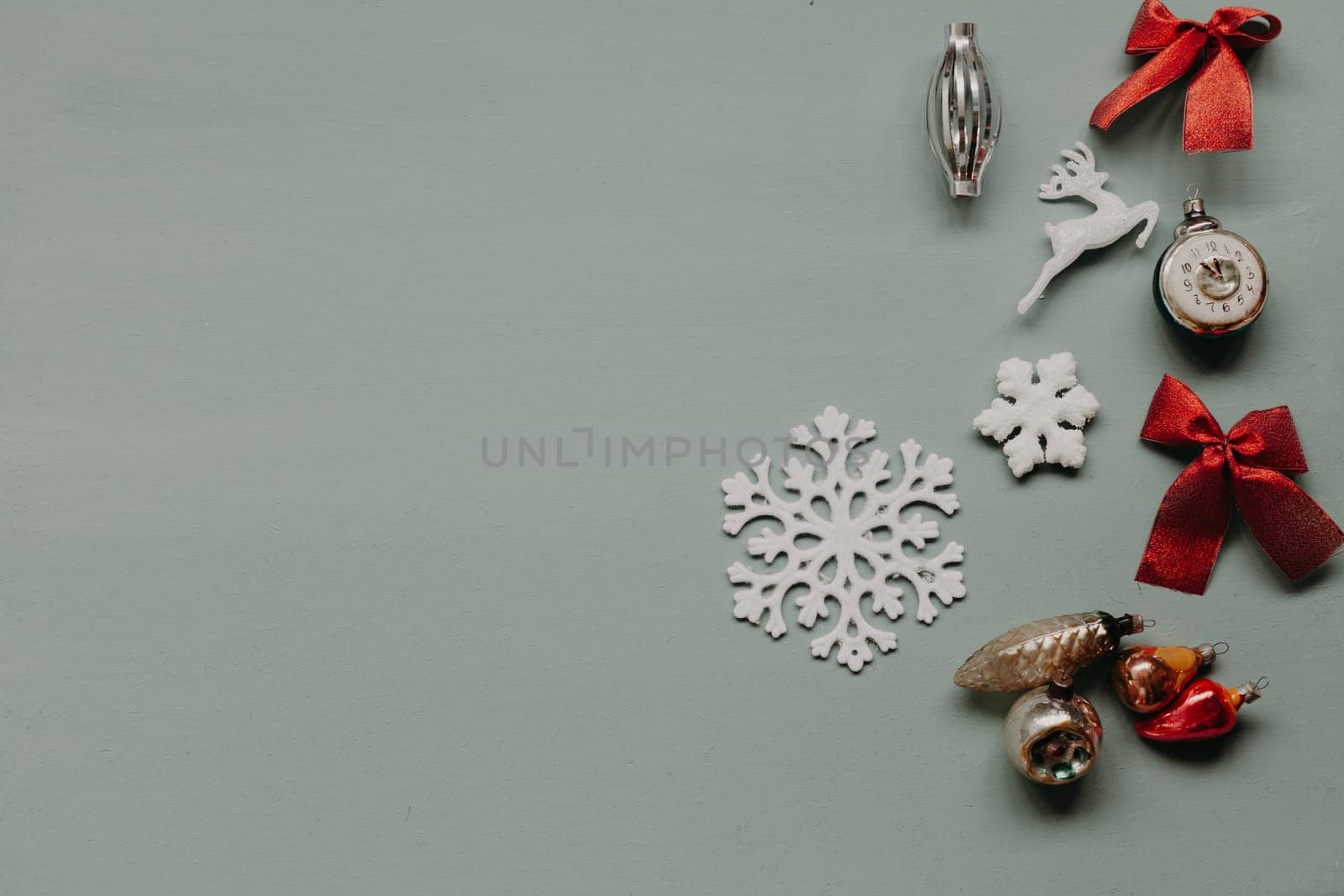 Christmas decoration Christmas tree toys new year gifts holiday green background by Simakov