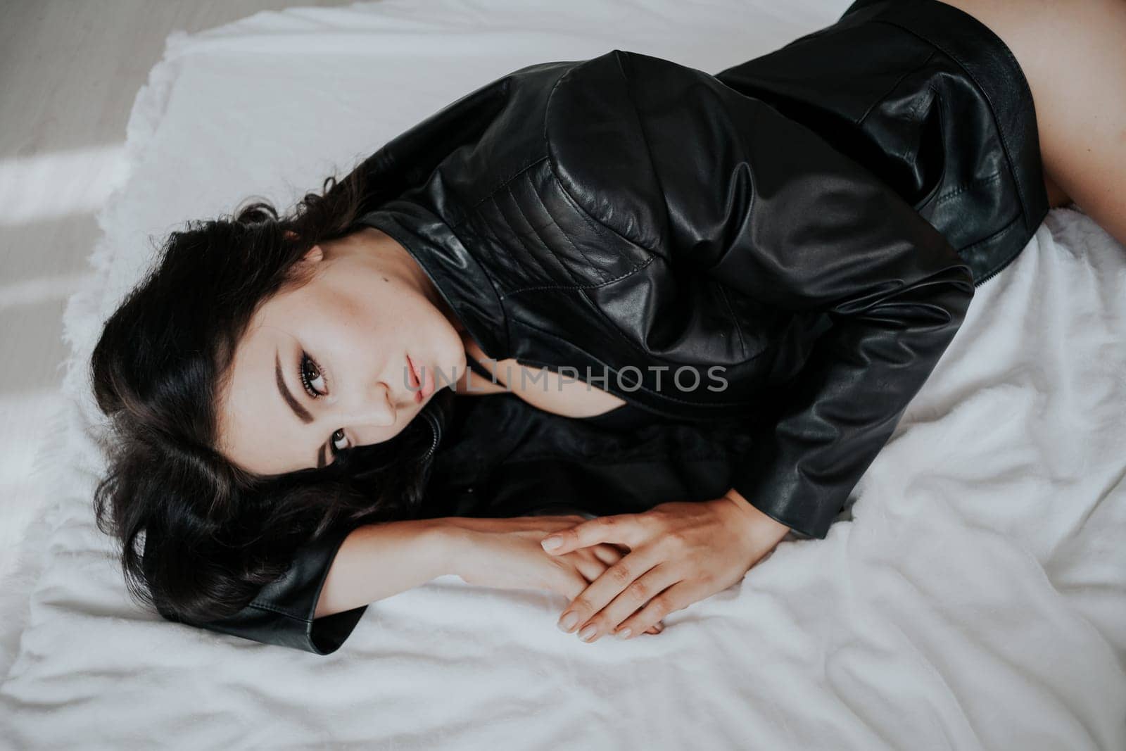 girl in black lingerie is lying on a white bed by Simakov