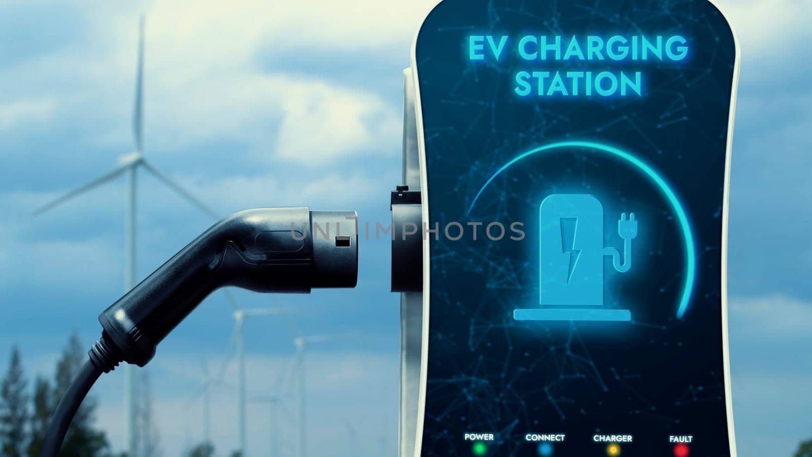 EV charger from EV car charging station in nature and wind turbine farm reducing CO2 emission. Technological advancement of alternative energy sustainability and EV car. Peruse