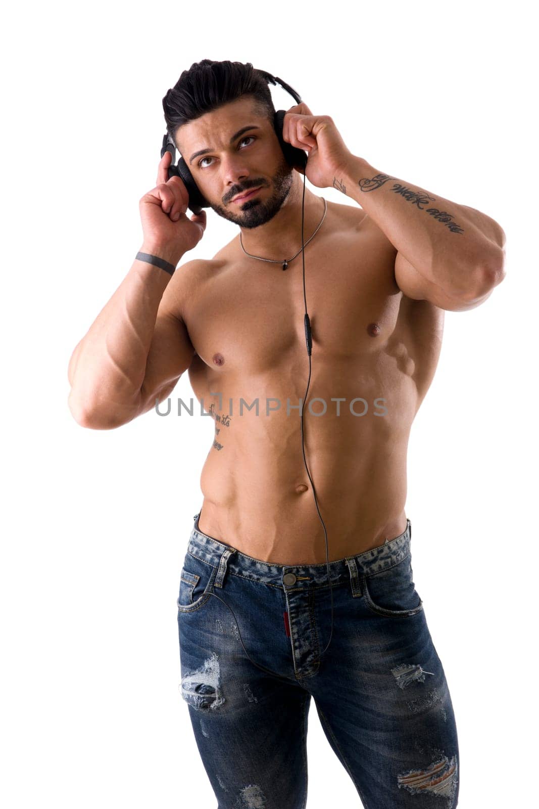 A Shirtless Man Listening to Music with Headphones by artofphoto