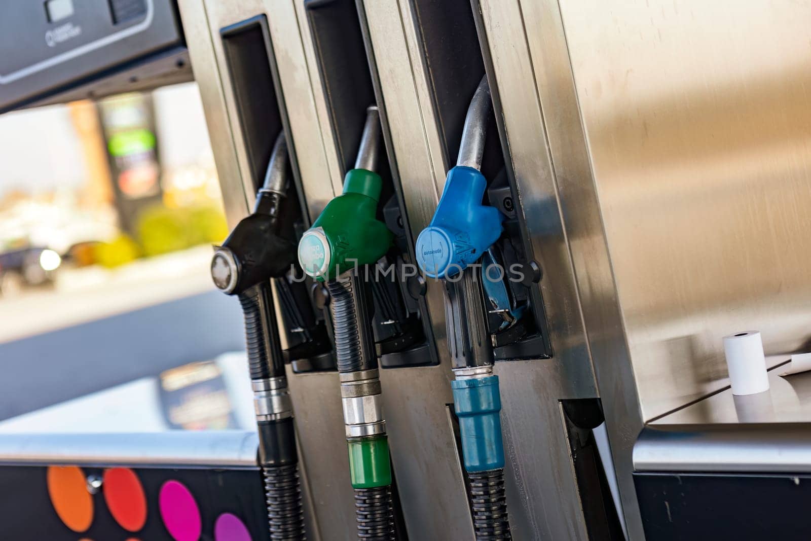 gas pump with rising price numbers, symbolizing the increasing fuel costs.