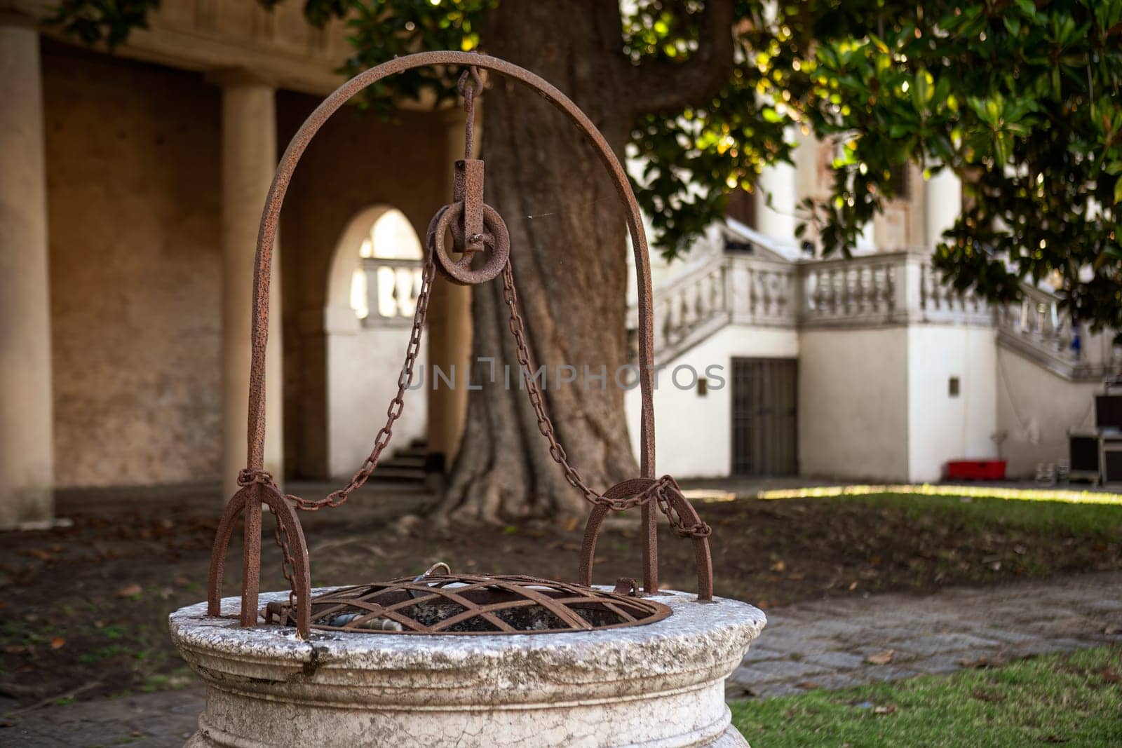 A detailed close-up of an ancient well, showcasing its historic and rustic beauty.